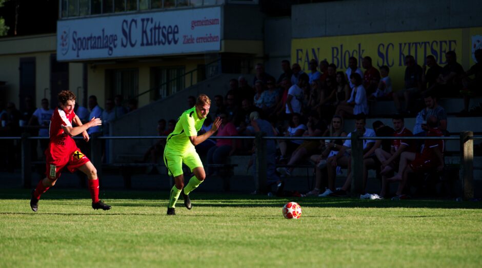 Jozef Sombat chased by Parndorf’s Thomas Lamster