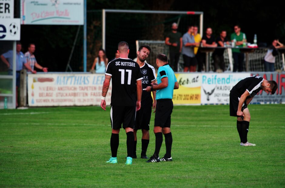 Patrick Dietmann fights a yellow card