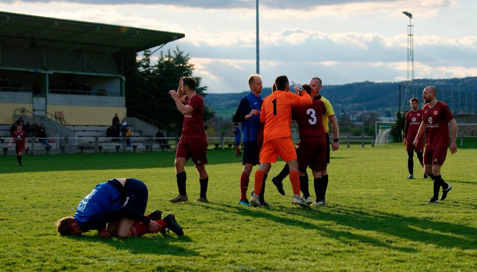 Sombat Penalty Sequence 12: Julius Pentek decides that Sombat is feigning injury and to go after referee Markus Kouba to overturn the penalty. This is a bad idea. Pentek may still have been able to stay on the field. Subject: soccer;football;burgenland;kittsee;Jozef Sombat;Julius Pentek;Andreas Roth