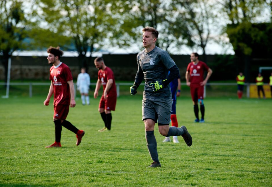 Sombat Penalty Sequence 23: UFC Pama substitute keeper Patrik Kukla takes the field, looking stressed and unready. This is promising. Subject: soccer;football;burgenland;kittsee;Patrik Kukla