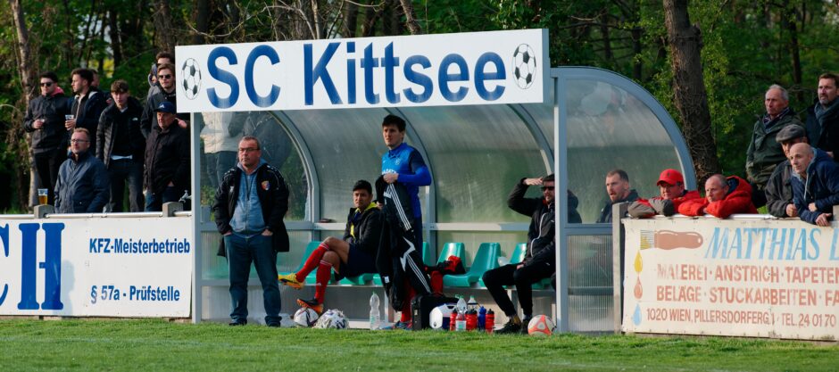 Sombat Penalty Sequence 26 Stone Face: Stony faces on the SC Kittsee bench. What looked like at least a tie if not a win, in what has been a dark almost winless season, is slipping away. SC Kittsee coach Manfred Wachter sends one time wunderkind winger Gerhard Krejcy in to freshen the attack. Subject: soccer;football;burgenland;kittsee;Manfred Wachter;Gerhard Krejcy