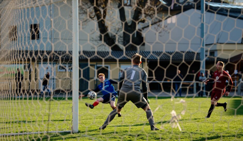 Looks like a Sombat goal for Kittsee: Kukla won't be fast enough to stop Sombat's hard shot Subject: soccer;football;burgenland;kittsee;Andreas Roth;Jozef Sombat;Patrik Kukla