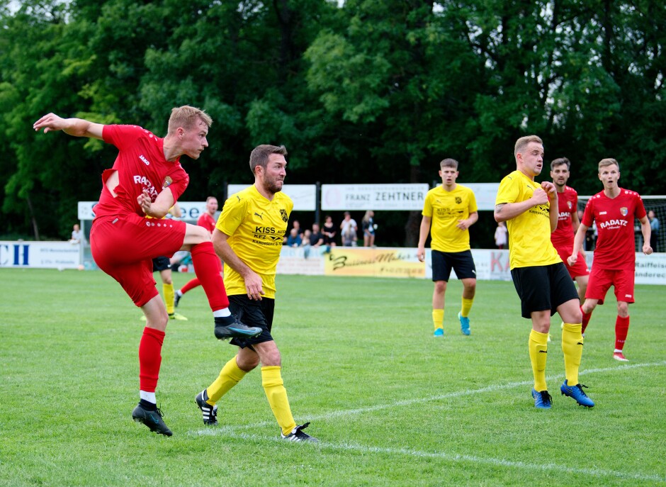 Sombat kick 4: Jozef Sombat watches his well hit ball scorch towards the net as ASV Jahrndorf's Mario Katzler and Alessandro Blazevic shudder in horror. This ball went just wide. Subject: soccer;football;burgenland;kittsee;ASV Jahrndorf;Mario Katzler;Jozef Sombat;Alessandro Blazevic