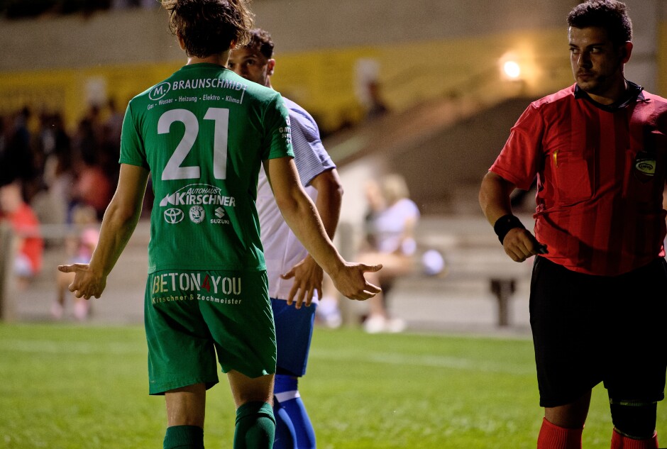 Mustafa Atik and Elias Luisser wrestle for the ball 2: Luisser is angry about the foul, the referee didn't see the clever hand of Atik. Atik feigns innocence. Subject: soccer;football;burgenland;kittsee;SC Kittsee;FC Monchof