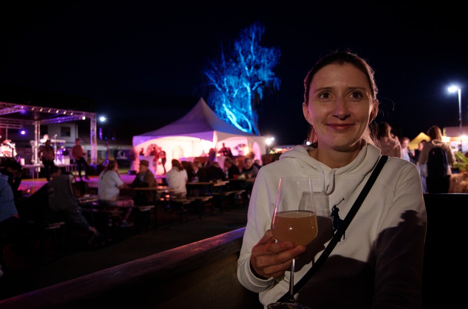 Lucia enjoying the fresh sturm from Frey: She's in the Bistro Hannah car, enjoying delicious goulash and the music. Subject: Kittsee;Kittsee Kirtag;Kirtag