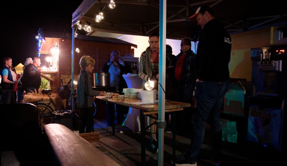 Bistro Hanna stand: Constantin collecting an ice cream cone. The goulash is in the silver pot. Subject: Kittsee;Kittsee Kirtag;Kirtag;Bistro Hannah