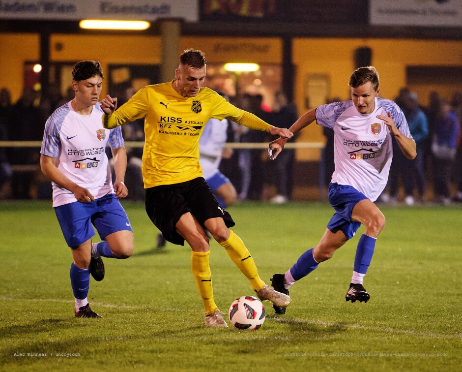 Christoph Drobela gives chase to David Bodo: Christoph Drobela gives chase to David Bodo. Bodo has scored six goals for Deutsch Jahrndorf this year. SC Kittsee marked him as closely as DJ marked Jozef Szombat preventing Bodo from scoring. Subject: SC Kittsee;ASV Deutsch Jahrndorf;II Liga Nord;Burgenland;soccer;football;Christoph Drobela;David Bodo;Mathias Skerlan