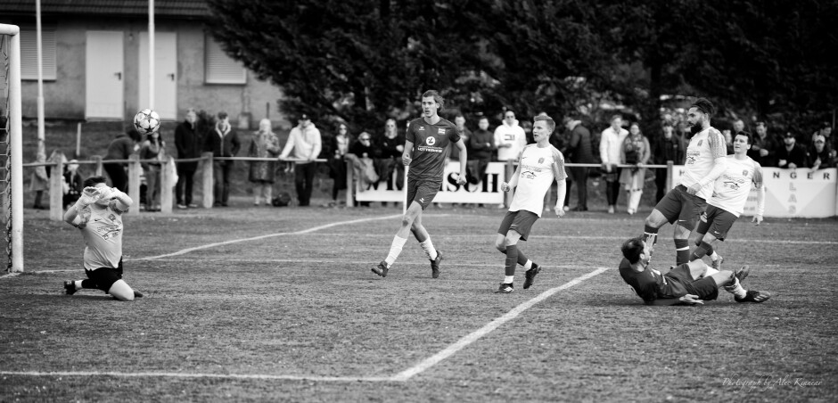 Manuel Schiszler makes big save: Christoph Werdenich's dangerous shot came close after the first goal. Werdenich rolls on the ground hoping for a penalty as Andreas Fabsich and Chistoper Drobola run towards the net.

A second UFC Pama goal would have almost ended the match, based on SC Kittsee's ineffective attack today. Manuel Schiszler steps up and makes a big save, keeping the game close. Schiszler had to make several big saves. Subject: soccer;football;burgenland;kittsee;Manuel Schiszler;Christoph Werdenich;Christoph Drobola;Juraj Fuska;Jaroslav Machovec