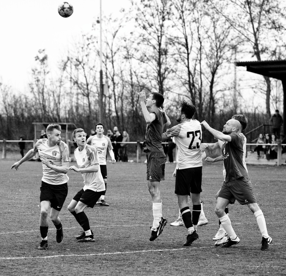 Peter Gallus holds Jaroslav Machovec: Peter Gallus is back up to his tricks again. Here we can see Gallus reach for Jaroslav Machovec's  shoulder while the ball is in the air to make sure Machovec cannot compete for the header. Subject: soccer;football;burgenland;kittsee;Peter Gallus;Jaroslav Machovec