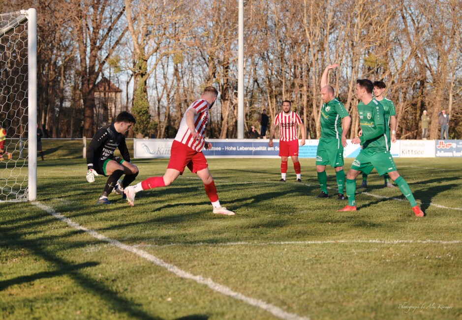 Michael Wernecker backheels the ball into FC Winden goal: While the ball went past Roman Ostojic, Daniel Pfeiffer quite correctly raises his hand for offside. Subject: soccer;football;burgenland;kittsee;SC Kittsee;FC Winden;Roman Ostojic;Daniel Pfeiffer;Michael Wernecker