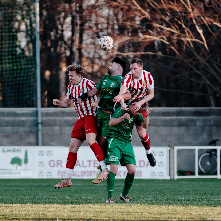 Four way header: The two Tomases, Banovic and Bastian go high in defense to keep Winden's Ibrahim Kamasik from the ball. That might be Marek Luscik getting a haircut from Bastian. Subject: soccer;football;burgenland;kittsee;SC Kittsee;FC Winden;Tomas Banovic;Tomas Bastian;Ibrahim Kamasik