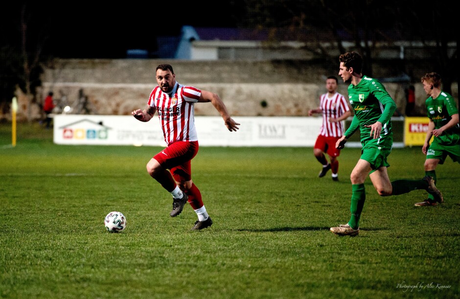 Adam Bombicz again on the move: Filip Balazi has drawn the short stick again chasing a Bombicz in full throttle Subject: soccer;football;burgenland;kittsee;SC Kittsee;FC Winden;Adam Bombicz;Filip Balazi