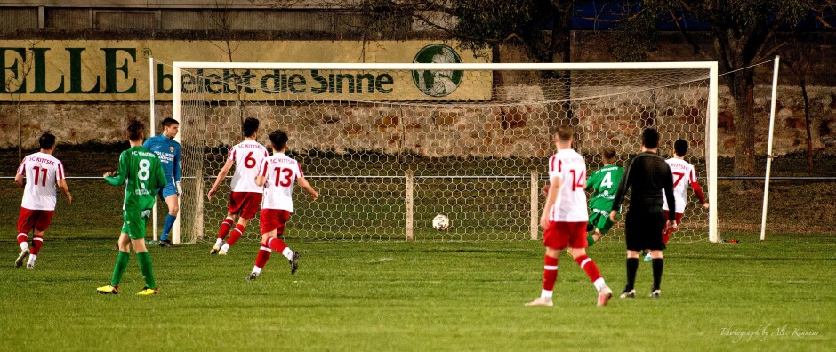 FC Winden press their own case: An FC Winden shot slips across the goal line while Manuel Schiszler watches and hopes Subject: soccer;football;burgenland;kittsee;SC Kittsee;FC Winden;Manuel Schiszler