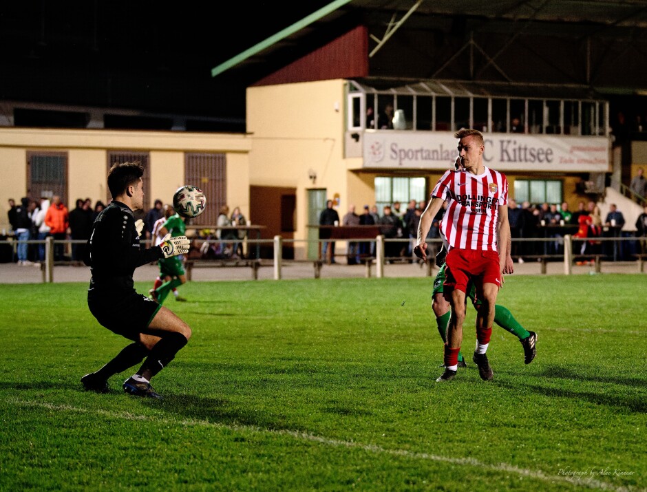 Jozef Sombat Second Goal II: The bounce takes a strange angle. Roman Ostojic has one eye on the ball and one eye on Sombat who has beat him once already tonight Subject: soccer;football;burgenland;kittsee;SC Kittsee;FC Winden;Jozef Sombat;Roman Ostojic;Daniel Pfeiffer