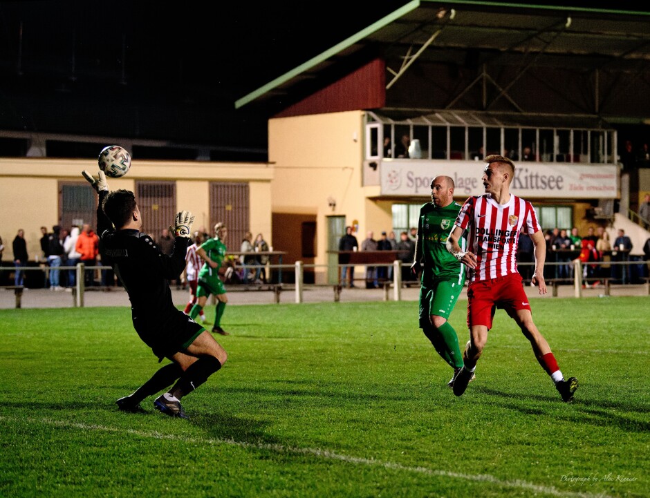 Jozef Sombat Second Goal III: Keeper Roman Ostojic guesses wrong and the ball starts to pass over his left glove Subject: soccer;football;burgenland;kittsee;SC Kittsee;FC Winden;Jozef Sombat;Roman Ostojic;Daniel Pfeiffer