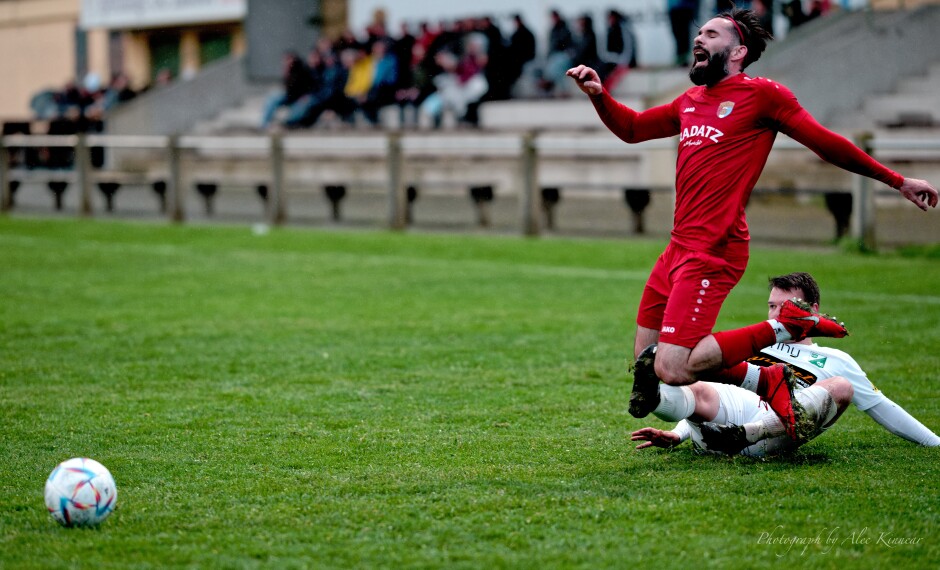 Fuska collapses under another violent Fleischhacker tackle: Juraj Fuska managed to leap over David Fleischhacker's first late tackle. Fleischacker took better aim the second time. This is not good football. Subject: Kittsee;Pamhagen;SK Kittsee;UFC Pamhagen;soccer;football;Juraj Fuska;David Fleischhacker