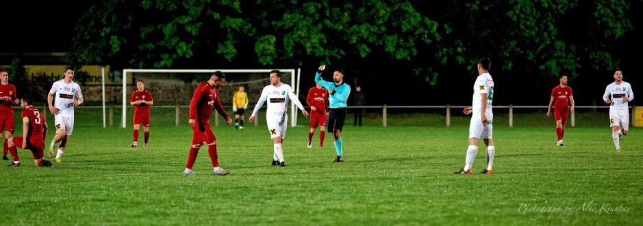 David Fleischhacker earns a well-deserved yellow card: Referee Erdem Sahin managed to keep the game going without attracting too much attention to his calls. What was a stroppy game did not descend into fisticuffs largely due to his calming influence. Still Sahin probably let too many late tackles pass in the early going, giving Pamhagen the impression they could keep tackling rough without consequence. Subject: Kittsee;Pamhagen;SK Kittsee;UFC Pamhagen;soccer;football;Patrick Dietmann;David Fleischhacker;Erdem Sahin