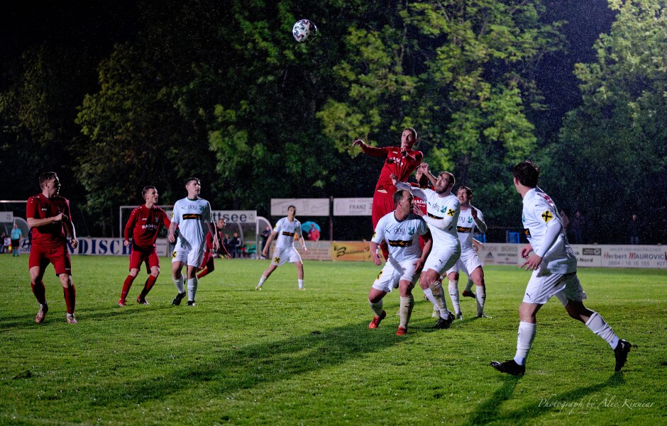 Jozef Sombat literally flies into the air for a high header: No one in II Liga Nord will outleap Sombat in full flight. Tamas Pirka and Christoph Koppi futilely try to slow Sombat down. Subject: Kittsee;Pamhagen;SK Kittsee;UFC Pamhagen;soccer;football;Jozef Sombat;Tamas Pirka;Christoph Koppi