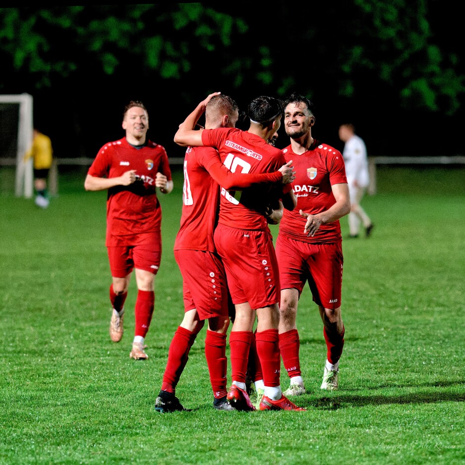 Celebrations all round for Sombat: Tobias Wisak, Jaroslav Machovec, Tomas Banovic rush to congratulate Sombat. The pressure is finally off, as a 2:0  lead at the end of regular time is relatively secure. Subject: Kittsee;Pamhagen;SK Kittsee;UFC Pamhagen;soccer;football;Jozef Sombat;Tobias Wisak;Jaroslav Machovec;Tomas Banovic