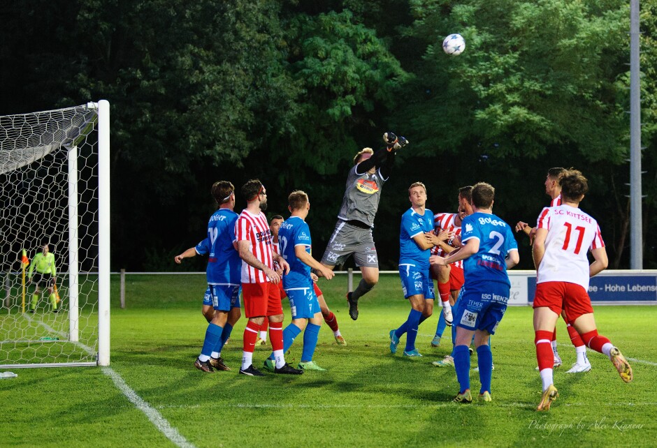 Early saves: Gols Keeper v was called on early and often. Could one of the Kittsee players could be leaping for this ball? Subject: SC Kittsee;SV Gols;burgenland;football;kittsee;soccer