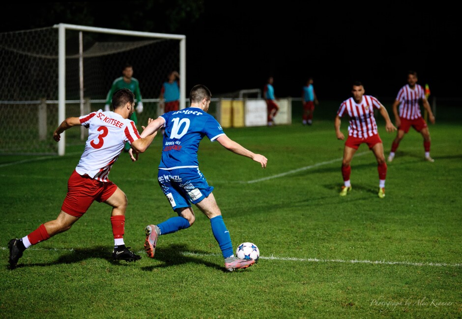 Arm brace: Patrick Dietmann shows off his veteran chops with a neat wrapped arm hold to knock Gols forward Fabian Ziniel off his balance yet not pick up a penalty. Subject: SC Kittsee;SV Gols;burgenland;football;kittsee;soccer