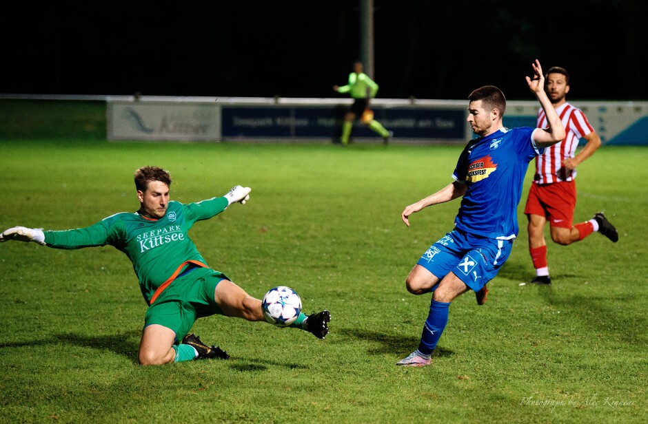 Big kick save: Fabian Ziniel slips past Patrick Dietmann but Manuel Schiszler is having none of Gols tonight and kicks the ball away before Ziniel can get his shot in. Subject: SC Kittsee;SV Gols;burgenland;football;kittsee;soccer