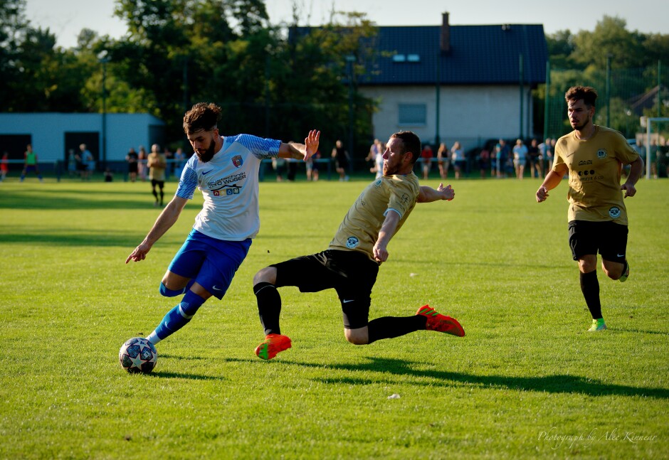 Frantisek Nagy attempts to shoot past Christian Hafner: Nagy looks good on this run, but experienced defender Christian Hafner does manage to kick the ball away. Subject: soccer;football;burgenland;kittsee;SC Kittsee;UFC Tadten