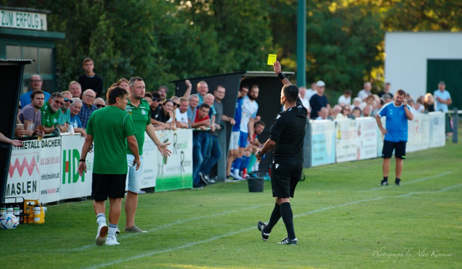 At last some excitement: UFC Pama reserve player and part-time trainer Michael Hafner takes a yellow card. Hafner is elder brother to star defender Christian. Subject: soccer;football;burgenland;kittsee;SC Kittsee;UFC Tadten