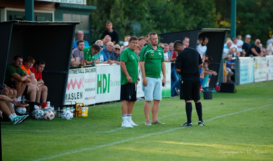 Hafner rolls his eyes: UFC Pama trainer Zoltan Fekete and Hafner seem very concerned with something downfield to my left. Referee Dursun Tosun is only concerned with noting Hafner's penalty. Subject: soccer;football;burgenland;kittsee;SC Kittsee;UFC Tadten