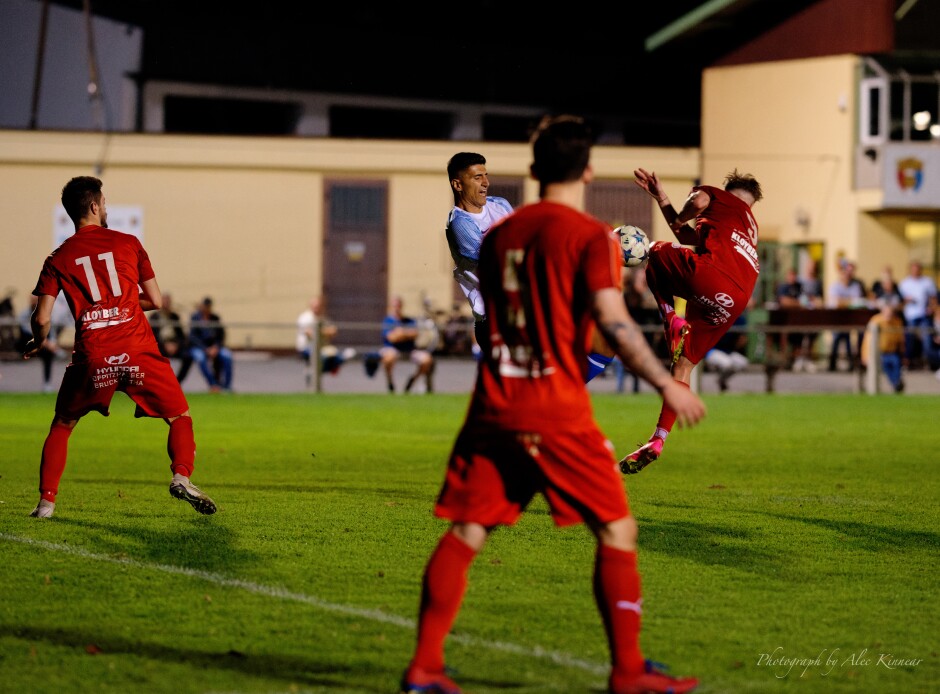 Breitenbrunn's Martin Hudak fouls Aleksandar Stanojcic: penalty kick: A nasty collision in front of the goal on high play from Martin Hudak. Subject: soccer;football;burgenland;kittsee;SC Kittsee;SC Breitenbrunn;Martin Hudak;Aleksandar Stanojcic