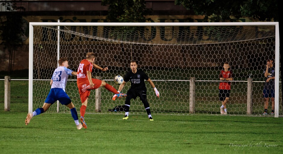 Robert Bartko stops Markus Pimpel from close range: Another big stop for Robert Bartko. Tomas Banovic attempts to cut off Markus Pimpel but cannot prevent his shot. Another big stop for Robert Bartko.  Subject: soccer;football;burgenland;kittsee;SC Kittsee;SC Breitenbrunn;Markus Pimpel;Robert Bartko;Tomas Banovic