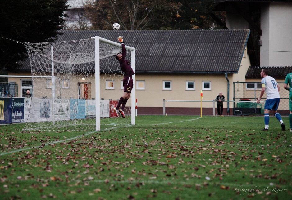 Libor Hrdlicka carefully pushes a well-placed ball over the net: It was a tight game. Libor Hrdlicka did well to get his hand on this dangerous shot and push the ball over the net. Subject: soccer;football;burgenland;kittsee;SC Kittsee;UFC Pamhagen