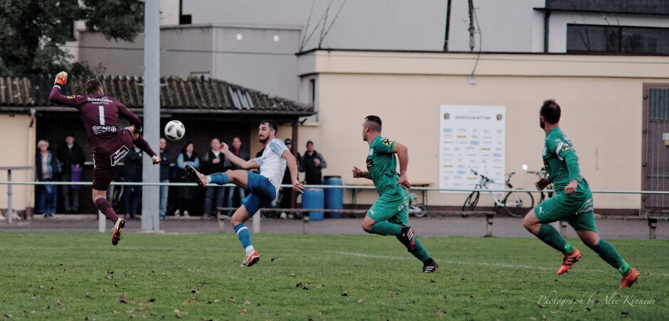 Hrdlicka blocks Machovec shot with flying leap: Machovec was unable to slip the bouncing ball past Hrdlicka Subject: soccer;football;burgenland;kittsee;SC Kittsee;UFC Pamhagen