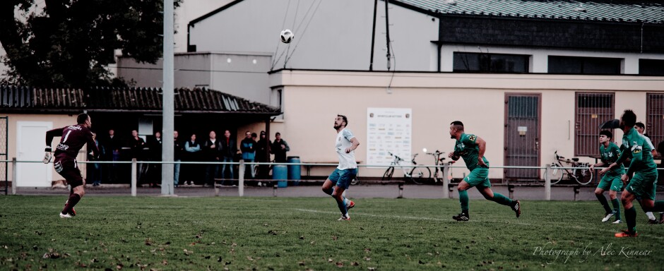 Jaroslav Machovec breaks in on net as a high crosser drops at his feet: Kittsee kept up the pressure in the UFC Pamhagen goal area. Libor Hrdlicka earned his cap today. Subject: soccer;football;burgenland;kittsee;SC Kittsee;UFC Pamhagen