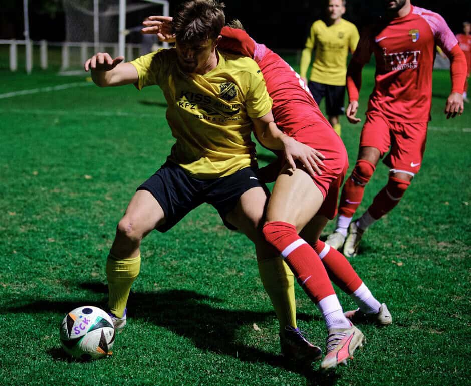 Boris Brydniak and Michal Belko wrestle for the ball: Defender Boris Brydniak niftily slips between Michal Belko and the ball Subject: soccer;football;burgenland;kittsee;SC Kittsee;ASV Deutsch Jahrndorf