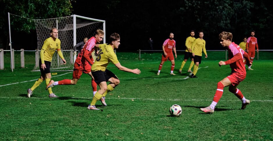 Michal Balko races to ball: Boris Brydniak futilely rushes to beat Balko to the ball while Jozef Sombat starts a run towards goal Subject: soccer;football;burgenland;kittsee;SC Kittsee;ASV Deutsch Jahrndorf