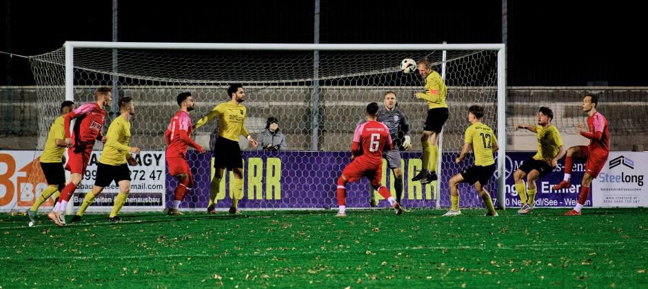 Carsten Lang leaps high to head ball away from his own goal: Carsten Lang jumps straight up one metre vertical and clears a very dangerous shot and keep Deutsch Jahrndorf in the game. Subject: soccer;football;burgenland;kittsee;SC Kittsee;ASV Deutsch Jahrndorf