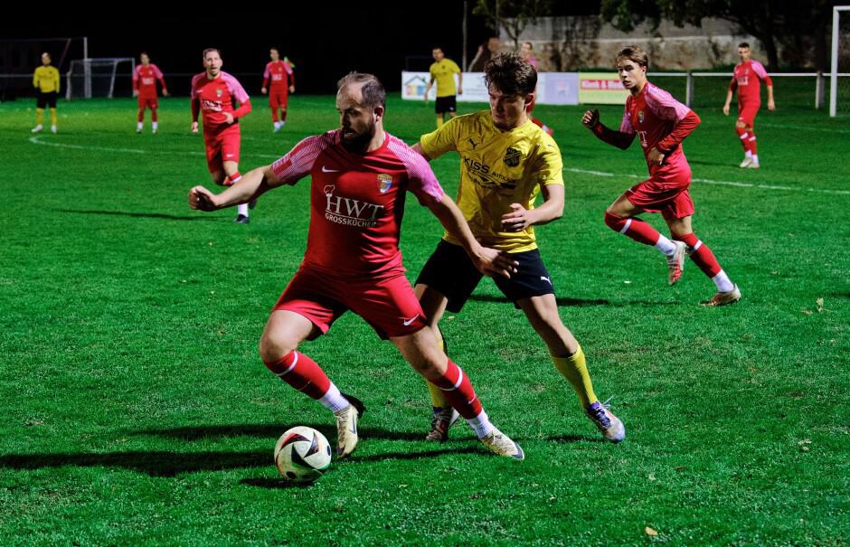 Wernecker ball control: Michael Wernecker keeps the ball away from defender Borys Brydniak. Subject: soccer;football;burgenland;kittsee;SC Kittsee;ASV Deutsch Jahrndorf