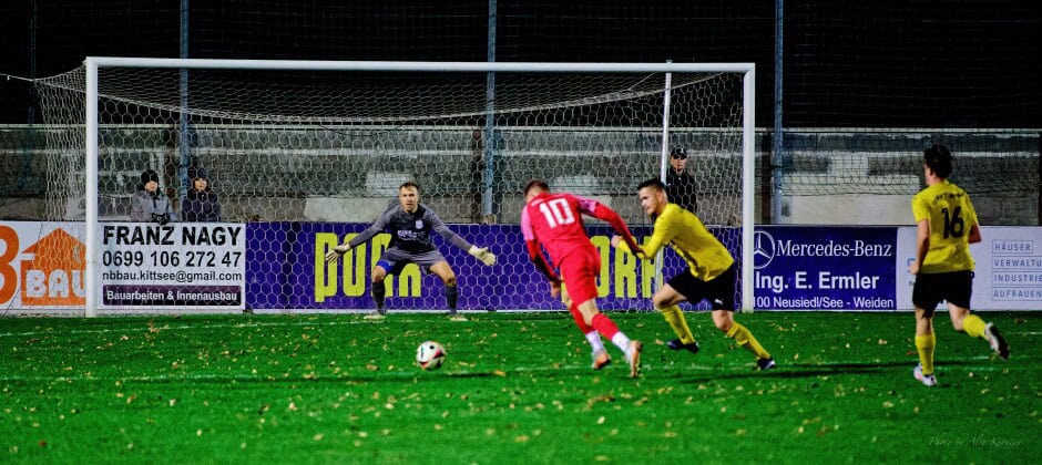 Jozef Sombat knocks a long shot past Unger: Sombat winds up to release hard shot which flies past a sprawling Michael Unger. Milan Losonci arrives too late. Subject: soccer;football;burgenland;kittsee;SC Kittsee;ASV Deutsch Jahrndorf