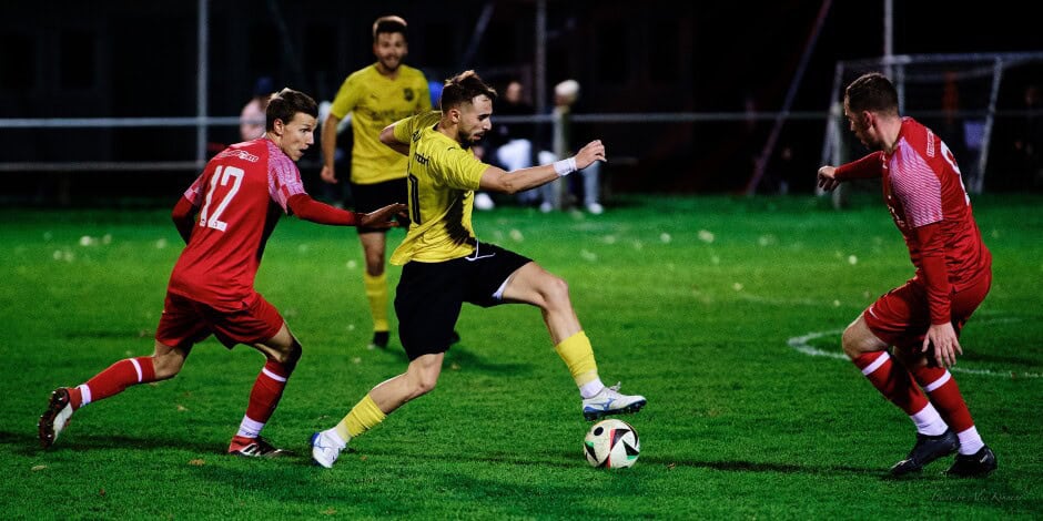 Ziga dribble: Ivan Ziga slips past a surprised Christoph Drobela and into a waiting Thomas Bastian Subject: soccer;football;burgenland;kittsee;SC Kittsee;ASV Deutsch Jahrndorf